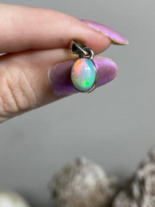 Welo Opal in Sterling Silver Pendant from Curious Muse Crystals Tagged with crystal healing, Crystal Jewelry, energy work, Ethiopian opal, flashy opal, hide-notify-btn, october crystal, opal crystal pendant, rainbow, reiki crystal, Sterling, sterling silver, Welo Opal, white opal pendant, witchy jewelry