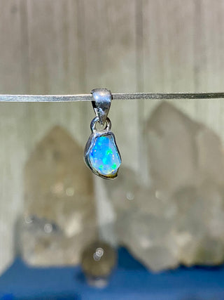 Welo Opal Raw Form in Sterling Silver Pendant from Curious Muse Crystals Tagged with crystal healing, Crystal Jewelry, energy work, Ethiopian opal, flashy opal, hide-notify-btn, october crystal, opal crystal pendant, rainbow, reiki crystal, Sterling, sterling silver, Welo Opal, white opal pendant, witchy jewelry