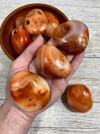 Carnelian Palm Stone | Red Banded Agate from Curious Muse Crystals Tagged with agate, banded agate, carnelian, carving, crystal, orange, palm stone, palmstone, polished, red