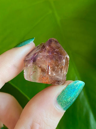 Dreamcoat Lemurian Generator - Polished Brazilian Tower Crystal from Curious Muse Crystals Tagged with clear, clear brazil quartz, dreamcoat lemurian, goethite rutile, hematite amethyst, hide-notify-btn, lemurian, lemurian generator, lemurian seed, polished, purple, red, secondary growth, super seven, synergy seven, tower, yellow