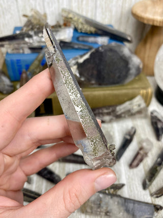 Quartz with Hematite and Lithium inclusions | Afghanistan from Curious Muse Crystals Tagged with Afghanistan, hematite, hematite red quartz, Laser quartz, lithium, Lithium quartz, Specular hematite