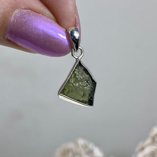 Moldavite in Sterling Silver Pendant | Genuine Tektite from Czech Republic from Curious Muse Crystals for 88. Tagged with clear, Crown crystal, crystal jewelry, genuine tektite, green, hide-notify-btn, moldavite, natural moldavite, sterling silver, tektite, Third eye stone, transformation