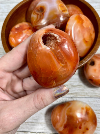 Carnelian Palm Stone | Red Banded Agate from Curious Muse Crystals Tagged with agate, banded agate, carnelian, carving, crystal, orange, palm stone, palmstone, polished, red