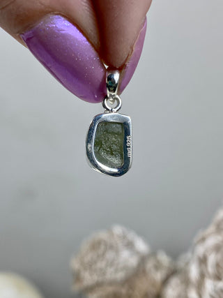 Moldavite in Sterling Silver Pendant | Genuine Tektite from Czech Republic from Curious Muse Crystals for 77. Tagged with clear, Crown crystal, crystal jewelry, genuine tektite, green, hide-notify-btn, moldavite, natural moldavite, sterling silver, tektite, Third eye stone, transformation