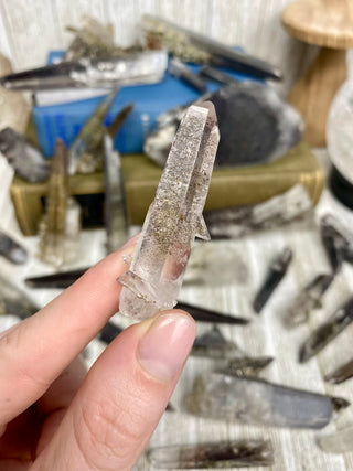 Quartz with Hematite and Lithium inclusions | Afghanistan from Curious Muse Crystals Tagged with Afghanistan, hematite, hematite red quartz, Laser quartz, lithium, Lithium quartz, Specular hematite