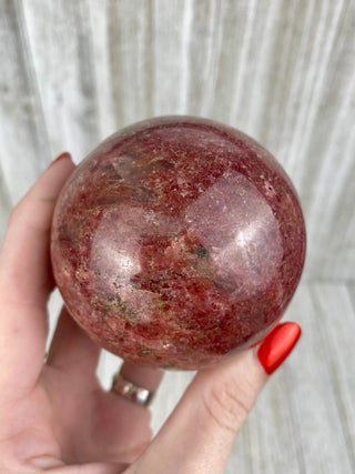 Rhodonite Sphere from Madagascar from Curious Muse Crystals Tagged with crystal, crystal energy, crystal sphere, hide-notify-btn, madagascar, palm stone, palmstone, pink, polished, red, reiki healing, Rhodonite, sphere