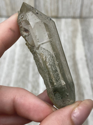 Nirvana Quartz Double Termination with Green Chlorite | High-Altitude Himalayan Crystal from Curious Muse Crystals Tagged with chlorite inclusion, clear, green, green Quartz, hand mined crystal, hide-notify-btn, high altitude quartz, High vibration stone, Himalayan Quartz, manifesting Quartz, Nirvana Quartz