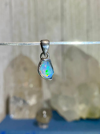 Welo Opal Raw Form in Sterling Silver Pendant from Curious Muse Crystals Tagged with crystal healing, Crystal Jewelry, energy work, Ethiopian opal, flashy opal, hide-notify-btn, october crystal, opal crystal pendant, rainbow, reiki crystal, Sterling, sterling silver, Welo Opal, white opal pendant, witchy jewelry