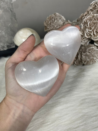Selenite 2” Heart Stone from Curious Muse Crystals Tagged with aura cleansing, beginner crystal, cleansing crystal, clear, crown chakra, crystal healing, crystal heart, crystal magic, energy work, genuine crystal, heart, selenite, soothing stone, white
