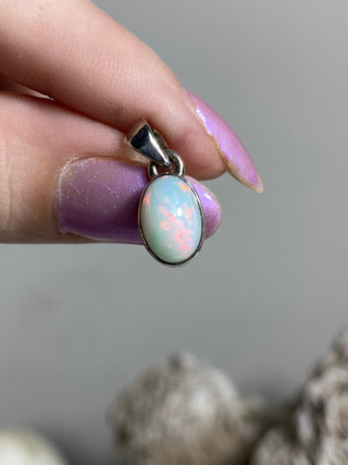 Welo Opal in Sterling Silver Pendant from Curious Muse Crystals Tagged with crystal healing, Crystal Jewelry, energy work, Ethiopian opal, flashy opal, hide-notify-btn, october crystal, opal crystal pendant, rainbow, reiki crystal, Sterling, sterling silver, Welo Opal, white opal pendant, witchy jewelry