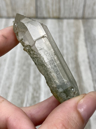 Nirvana Quartz Double Termination with Green Chlorite | High-Altitude Himalayan Crystal from Curious Muse Crystals Tagged with chlorite inclusion, clear, green, green Quartz, hand mined crystal, hide-notify-btn, high altitude quartz, High vibration stone, Himalayan Quartz, manifesting Quartz, Nirvana Quartz