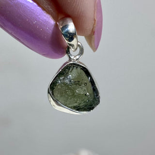 Moldavite in Sterling Silver Pendant | Genuine Tektite from Czech Republic from Curious Muse Crystals for 77. Tagged with clear, Crown crystal, crystal jewelry, genuine tektite, green, hide-notify-btn, moldavite, natural moldavite, sterling silver, tektite, Third eye stone, transformation