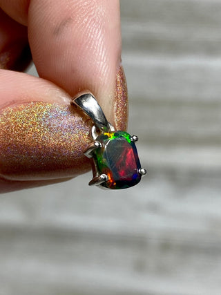 Black Opal in Sterling Silver Pendant from Curious Muse Crystals for 70. Tagged with black opal, crystal healing, Crystal Jewelry, energy work, flashy opal, hide-notify-btn, opal, opal crystal pendant, reiki crystal, Sterling, sterling silver, witchy