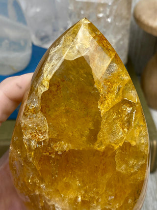 Hematite in Quartz Flame | Stunning Inclusions from Curious Muse Crystals Tagged with carving, clear, crystal, hematite, hematite red quartz, hematoid quartz, hide-notify-btn, orange, polished, quartz, yellow