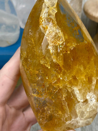 Hematite in Quartz Flame | Stunning Inclusions from Curious Muse Crystals Tagged with carving, clear, crystal, hematite, hematite red quartz, hematoid quartz, hide-notify-btn, orange, polished, quartz, yellow
