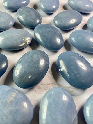 Angelite Palm Stone from Curious Muse Crystals Tagged with akashic record, angelite, anhydrite mineral, blue, blue crystal stone, calming energy, communication stone, crystal healing, palmstone, past life recall, spirit guide