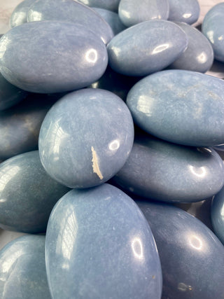 Angelite Palm Stone from Curious Muse Crystals Tagged with akashic record, angelite, anhydrite mineral, blue, blue crystal stone, calming energy, communication stone, crystal healing, palmstone, past life recall, spirit guide