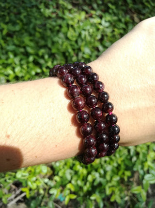 Garnet 8mm Round Bead Crystal Gemstone Bracelet from Curious Muse Crystals Tagged with 8mm bead bracelet, bracelet, garnet, garnet bracelet, gemstone jewelry, genuine crystal, natural garnet, passion stone, red, red garnet, red gemstone, round bead jewelry, stretch bracelet