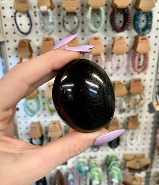 Black Tourmaline Polished Palm Stone from Curious Muse Crystals Tagged with black, black palm stone, black Tourmaline, Brazilian mineral, genuine crystal, grounding stone, mental stress, natural mineral, palmstone, pocket crystal, protection crystal, reiki crystal, shadow work, tourmaline