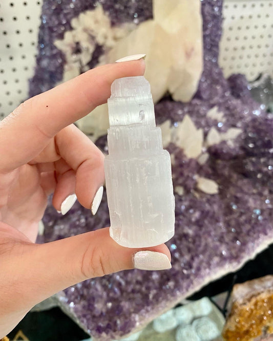 Selenite Mini Raw Tower - Cleansing from Curious Muse Crystals for 5.00. Tagged with aura cleansing, cleansing, cleansing crystal, cleansing wand, crown chakra, crystal healing, crystal magic, Crystal tower, energy work, genuine crystal, raw selenite, selenite, selenite wand, soothing stone, tower