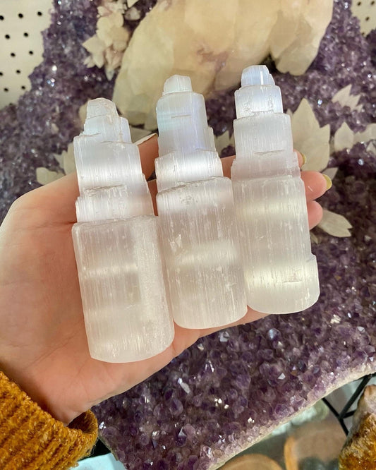 Selenite Small Raw Tower - Cleansing from Curious Muse Crystals for 8.00. Tagged with aura cleansing, cleansing, cleansing crystal, cleansing wand, crown chakra, crystal healing, crystal magic, Crystal tower, energy work, genuine crystal, raw selenite, selenite, selenite wand, soothing stone, tower
