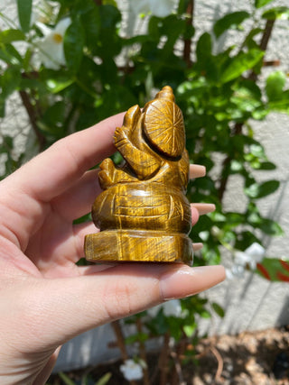 Tigers Eye Ganesha Hand-carved in Kathmandu, Nepal from Curious Muse Crystals Tagged with brown, confidence stone, crystal carving, crystal ganesha, ganesh statue, hand carved idol, healing crystal, high vibration, hindu god, obstacle breaker, reiki work, road opener, tiger eye, tiger eye ganesha, yellow
