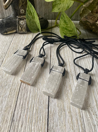 Selenite on Black Cord Necklace - Cleansing - Satin Spar from Curious Muse Crystals Tagged with cleansing stone, clear, crystal jewelry, crystal necklace, energy work, jewelry, mineral on cord, natural crystal, necklace, raw crystal, raw stone pendant, reiki healing, satin spar, selenite, white