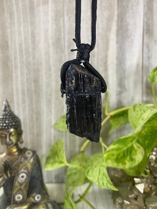 Black Tourmaline on Cord Necklace | Protection Crystal Jewelry from Curious Muse Crystals for 9. Tagged with black, crystal jewelry, crystal necklace, energy work, high vibration, light worker, mineral on cord, natural crystal, necklace, protection necklace, raw crystal, raw stone pendant, raw tourmaline, reiki healing, tourmaline