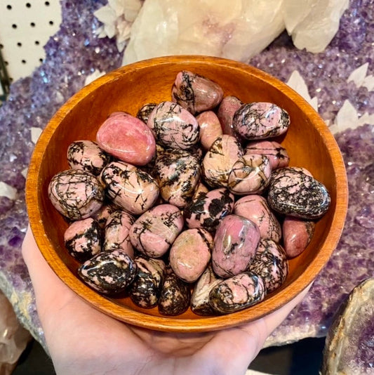 Rhodonite Tumbled Stone - Love & Compassion from Curious Muse Crystals for 2. Tagged with Crystal healing, Crystal magic, genuine crystal, grief release, heart chakra, pink and black, pink crystal stone, Rhodonite, self love, soothing stone, soul healing, sweet dreams, tumbled stone