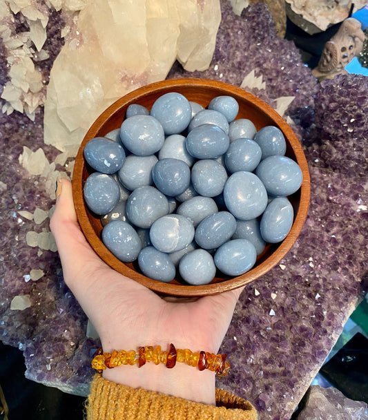 Angelite Tumbled Stone from Curious Muse Crystals for 2. Tagged with Angeline, angelite, anhydrite stone, blue crystal, calming crystal, calming stone, cleansing crystal, communication stone, Crystal healing, genuine crystal, reiki work, throat chakra, tumbled stone