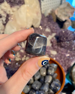 Iolite Tumbled Stone - Third Eye from Curious Muse Crystals Tagged with blue, Crystal healing, flashy blue crystal, genuine crystal, high vibrational, inspiration stone, iolite, Iolite stone, purple, reiki work, third eye crystal, tumbled stone