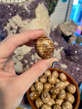 Aragonite Tumbled Stone from Curious Muse Crystals Tagged with anxiety stone, banded aragonite, brown, brown aragonite, Crystal healing, earth healing, genuine crystal, geopathic stress, gridding crystal, grounding crystal, reiki work, root chakra, stress release, tumbled stone, yellow