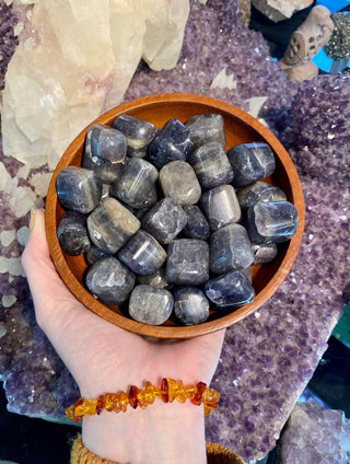 Iolite Tumbled Stone - Third Eye from Curious Muse Crystals Tagged with blue, Crystal healing, flashy blue crystal, genuine crystal, high vibrational, inspiration stone, iolite, Iolite stone, purple, reiki work, third eye crystal, tumbled stone