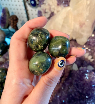 Nephrite Jade Tumbled Stone - Prosperity and Wealth from Curious Muse Crystals for 2.50. Tagged with Crystal healing, dark green Jade, genuine crystal, green, green Jade stone, high vibrational, jade, mineral specimen, nephrite Jade, reiki work, round Jade piece, tumbled stone