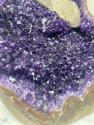 Deep Purple Amethyst with Calcite | Cut Base Geode from Uruguay from Curious Muse Crystals Tagged with aaa grade crystal, amethyst, Amethyst Cluster, calcite on amethyst, cut base amethyst, emotional balance, extra dark amethyst, goethite amethyst, high grade, high vibrational, purple, spiritual protection, third eye, unique amethyst, Uruguay geode