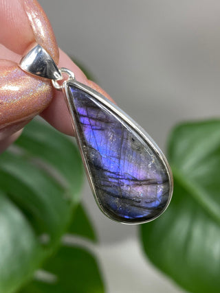 Purple Flash Labradorite in Sterling Silver Pendant - PL4 from Curious Muse Crystals for 79. Tagged with big crystal necklace, crystal energy, Crystal Jewelry, dark purple lab, full flash lab, hide-notify-btn, Labradorite, long oval pendant, psychic protection, purple, purple lab jewelry, reiki healing, silver crystal jewel, sterling silver, witchy jewelry