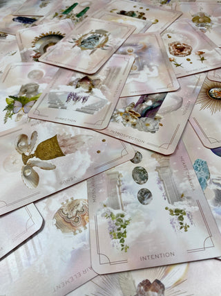 Astral Realms Crystal Oracle | Astrology Dreamscapes | Surrealism Art from Curious Muse Crystals for 24.95. Tagged with alternative tarot, astrology tarot, bright pastel art, crystal oracle, divination tool, feminine tarot, liminal space tarot, major arcana, minor arcana, surrealism tarot, tarot deck, throat chakra, with guidebook