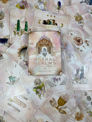 Astral Realms Crystal Oracle | Astrology Dreamscapes | Surrealism Art from Curious Muse Crystals for 24.95. Tagged with alternative tarot, astrology tarot, bright pastel art, crystal oracle, divination tool, feminine tarot, liminal space tarot, major arcana, minor arcana, surrealism tarot, tarot deck, throat chakra, with guidebook