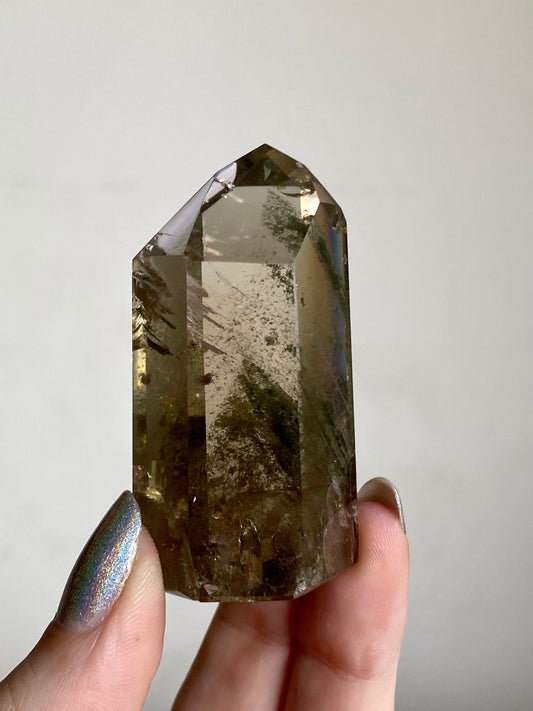 Smoky Quartz with Chlorite Phantoms - Polished Tower - Six Side Generator from Curious Muse Crystals for 38.00. Tagged with Crystal decor, Crystal healing, genuine crystal, hide-notify-btn, high quality natural, Lemurian Quartz, Lemurian seed, mineral collection, natural mineral, quartz, reiki healing, smoky quartz, tower