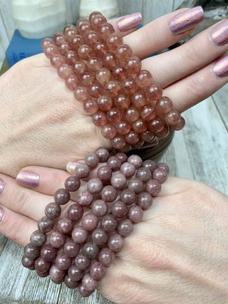 Strawberry Quartz 8mm Round Bead Crystal Bracelet from Curious Muse Crystals for 8. Tagged with 8mm beads, bracelet, clear, crystal jewelry, gemstone bead, gemstone jewelry, healing jewelry, hematite, hematite red quartz, inclusion quartz, lepidolite, quartz, red