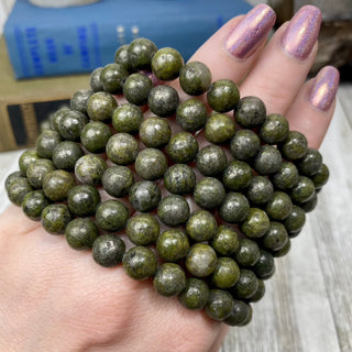 Epidote with Pyrite 8mm Round Bead Crystal Bracelet from Curious Muse Crystals for 7. Tagged with 8mm beads, bracelet, crystal jewelry, epidote, gemstone bead, gemstone jewelry, gold, green, healing jewelry, pyrite