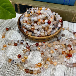 Dendritic Agate 8mm Round Bead Crystal Bracelet from Curious Muse Crystals Tagged with 8mm beads, agate, bracelet, clear, crystal jewelry, dendrite, dendritic agate, gemstone bead, gemstone jewelry, healing jewelry, orange, red
