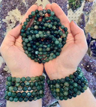 Moss Agate 8mm Round Bead Crystal Bracelet - Growth & Abundance from Curious Muse Crystals Tagged with 8mm beads, agate, bracelet, clear, crystal jewelry, gemstone bead, gemstone jewelry, green, healing jewelry, moss agate